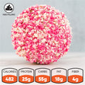 A close-up of the Strawberry Crunch Milkshake Buffin Muffin reveals a round, pink and white snack ball with a crumbly texture and a delicious strawberry milkshake flavor. Nutrition facts display: 482 calories, 25g protein, 55g carbs, 18g fat, and 4g fiber—making it a high-protein treat. An icon highlights its filled center.