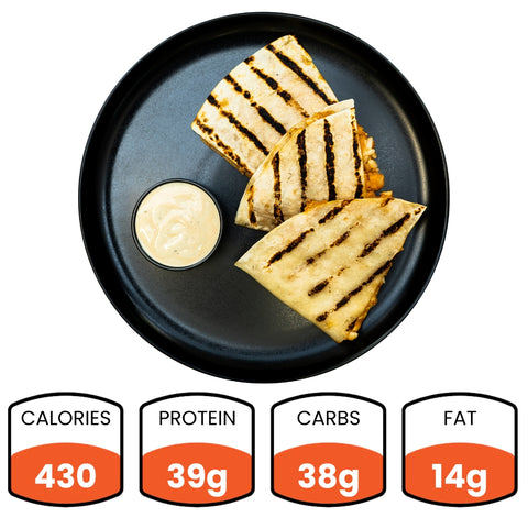 Grilled quesadilla slices with a dipping sauce on a black plate, accompanied by nutritional information icons.