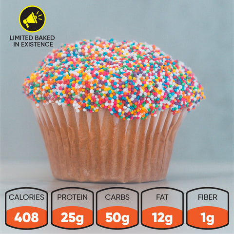 A Buffin Muffin "The Trendsetter Cake" with colorful sprinkles sits on a gray surface—ideal for pre or post workout. Nutrition: 408 calories, 25g protein, 50g carbs, 12g fat, and 1g fiber. "Limited Baked in Existence" appears in the corner.