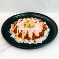 The Vegan Cheeseburger Bowl features white rice, seasoned Beyond Beef, shredded vegan cheese, creamy orange sauce, and diced pickles—delicious and perfect for vegan meal prep.