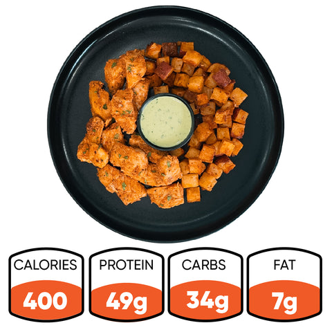 A black plate holds the Zeus Bowl V2: seasoned chicken kebab chunks, diced roasted potatoes, and a cup of dipping sauce. Nutrition stats below show 400 calories, 49g protein, 34g carbs, and 7g fat.